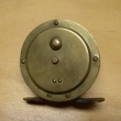 ROUSEK  mosazný ,   pr. 62 mm, s řehtačkou, vyvážená klička ,signovaný Rousek Č.S.R